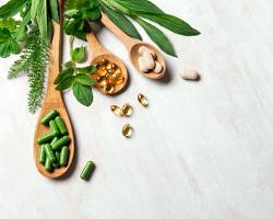 Flat lay of natural health vitamins, herbal supplements, and wellness care products